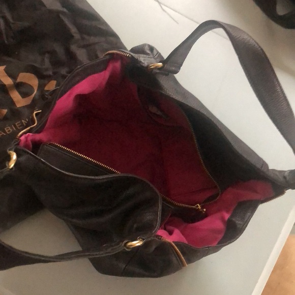 Black purse with hot pink lining by Fab. - Picture 2 of 3